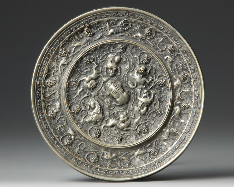 A CHINESE CIRCULAR "LIONS AND BIRDS" SILVER MIRROR, TANG DYNASTY (618-907 AD)