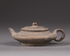 A Chinese yixing flattened teapot and cover