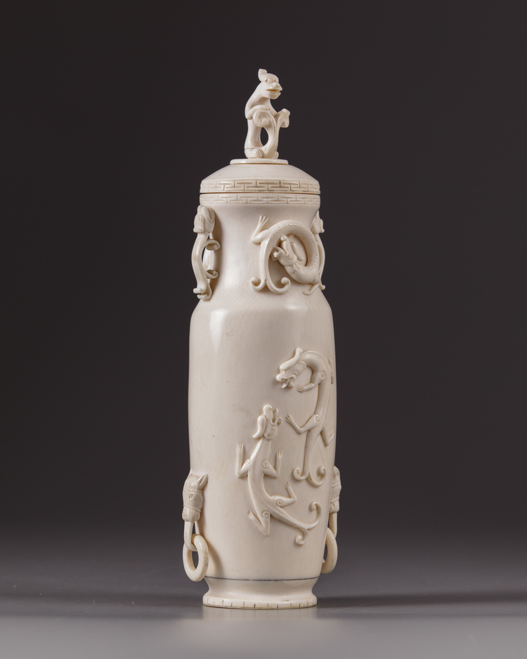 A Chinese ivory ‘chilong’ vase and cover