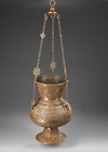 A MAMLUK-STYLE PIERCED BRASS MOSQUE LAMP, SYRIA OR EGYPT, 19TH CENTURY