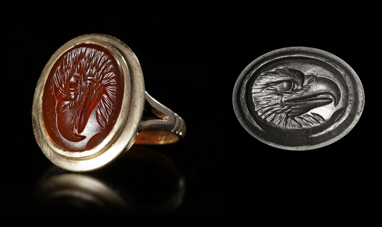 A CARNELIAN ROMAN INTAGLIO OF AN EAGLE'S HEAD, 1ST CENTURY AD