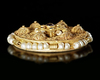 A FATIMID GOLD ROUNDEL WITH PEARL SURROUND, 10TH-11TH CENTURY
