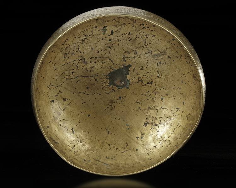 A SILVER INLAID BRASS BOWL, 14TH CENTURY