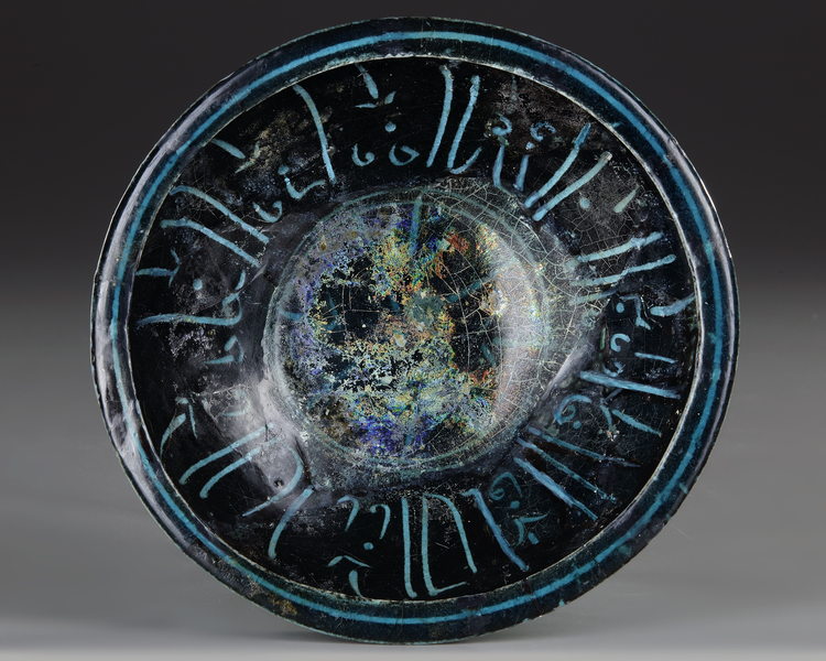 A BLACK AND TURQUOISE GLAZED KASHAN  BOWL, PERSIA, 13TH CENTURY