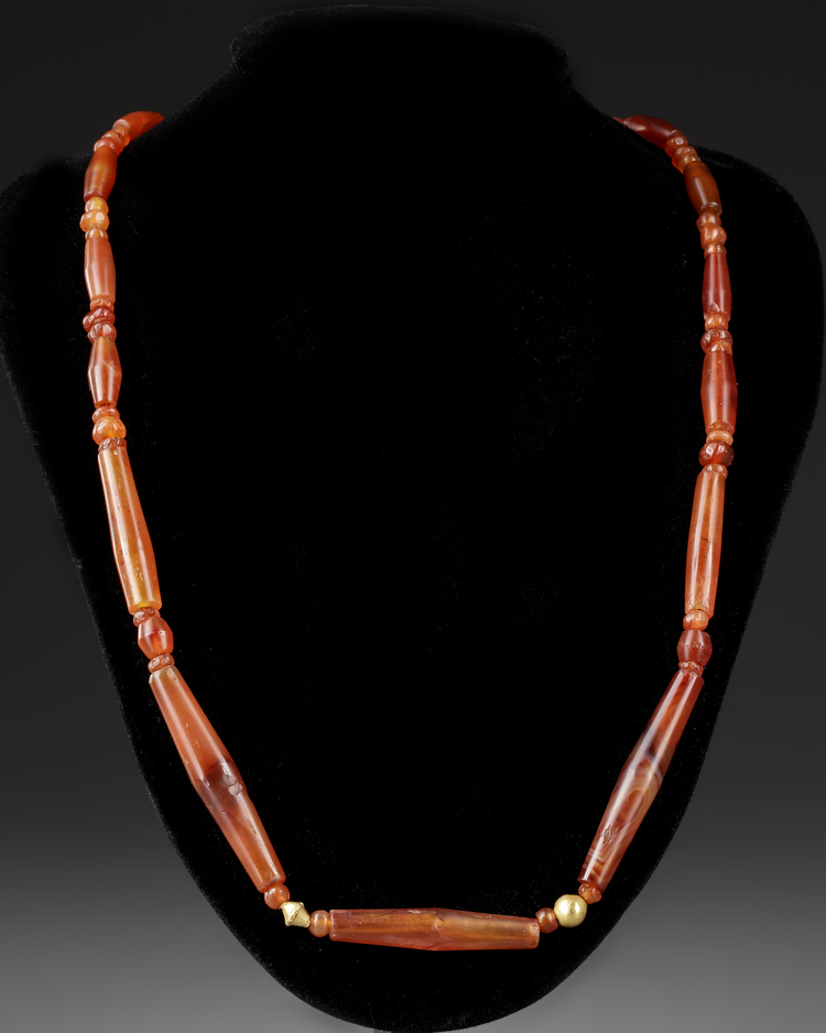 A CARNELIAN NECKLACE, NEAR EASTERN, 3RD MILLENNIUM BC