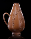 A ROMAN RED WARE PERIFORM VASE, ROMAN, 3RD CENTURY AD