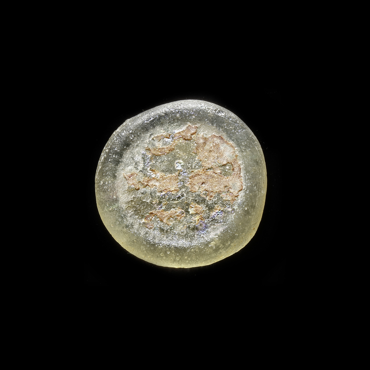 AN EARLY ISLAMIC GLASS WEIGHT OF DOUBLE DIRHAM, 10TH-11TH CENTURY