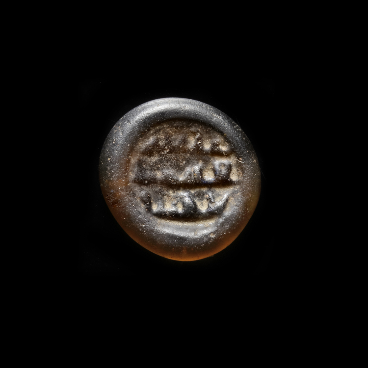 AN EARLY ISLAMIC GLASS WEIGHT OF DIRHAM, 10TH-11TH CENTURY