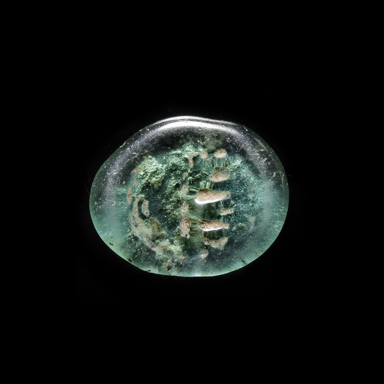 AN EARLY ISLAMIC GLASS WEIGHT OF DIRHAM, 10TH-11TH CENTURY