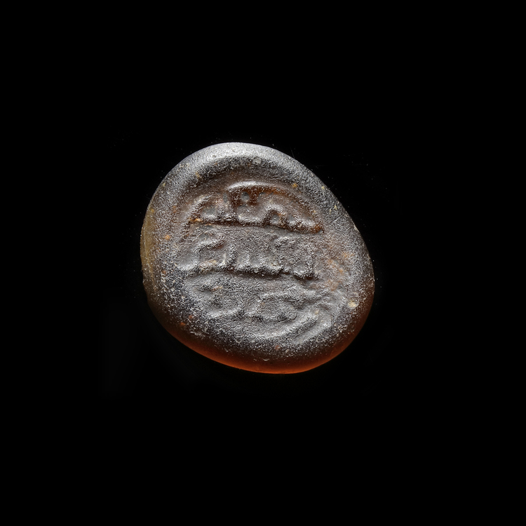 AN EARLY ISLAMIC GLASS WEIGHT OF DIRHAM, 10TH-11TH CENTURY