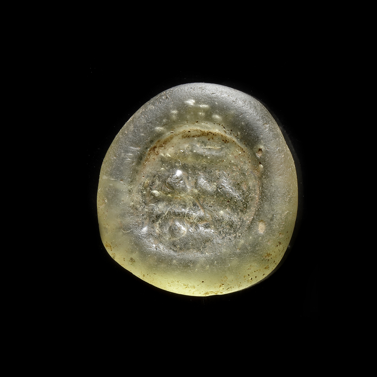 AN EARLY ISLAMIC GLASS WEIGHT OF DOUBLE DIRHAM, 10TH-11TH CENTURY