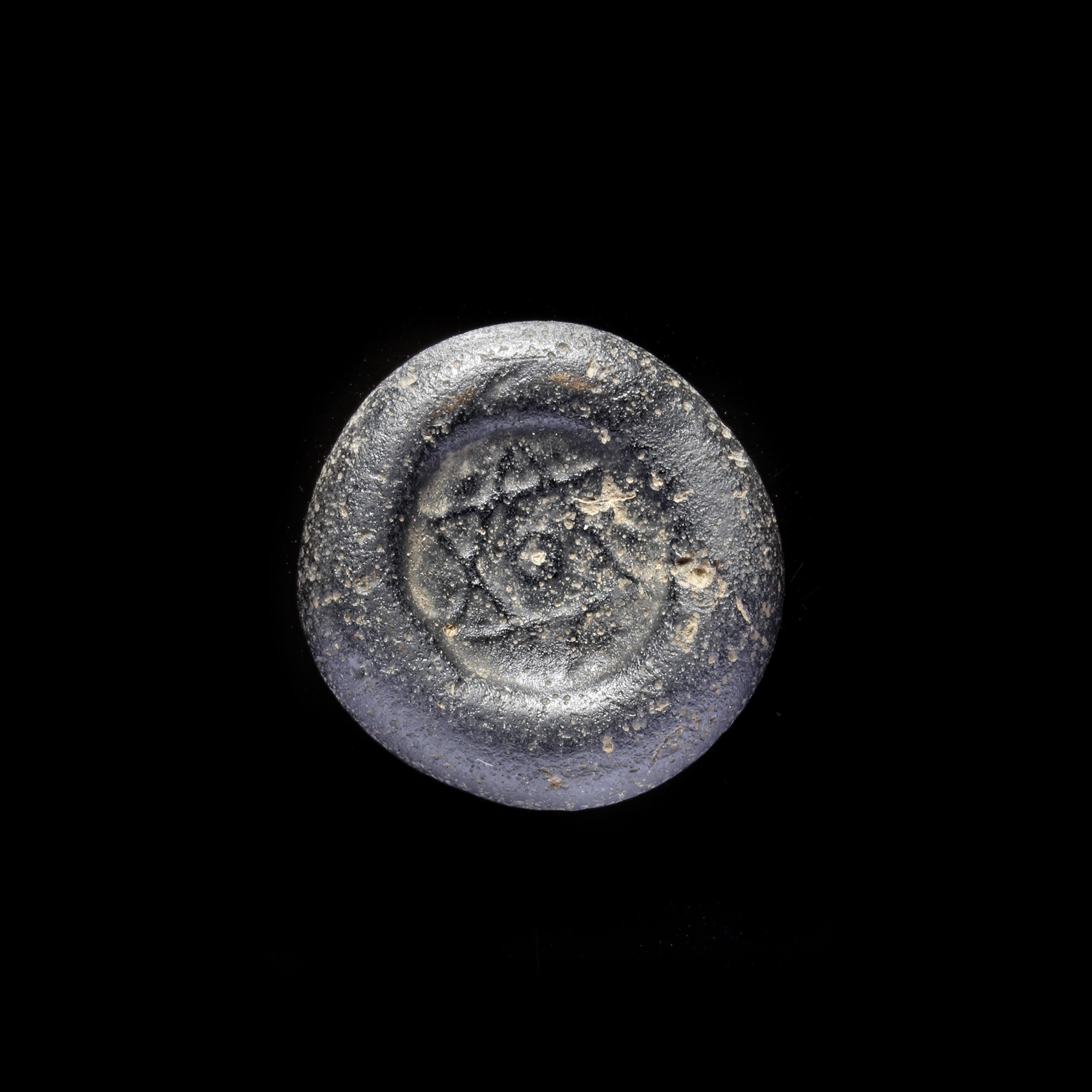 A FATIMID GLASS WEIGHT OF DOUBLE DIRHAM, EGYPT 10TH-11TH CENTURY