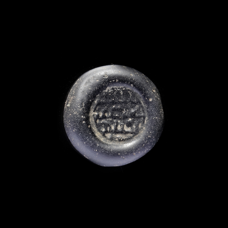 AN EARLY ISLAMIC GLASS WEIGHT OF DOUBLE DIRHAM, 10TH-11TH CENTURY