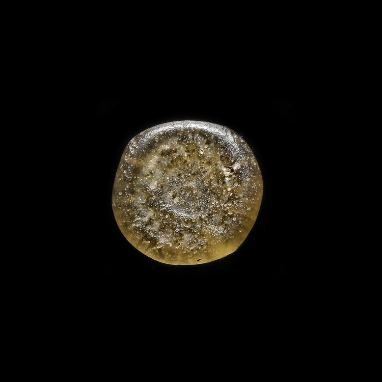 AN EARLY ISLAMIC GLASS WEIGHT OF DIRHAM