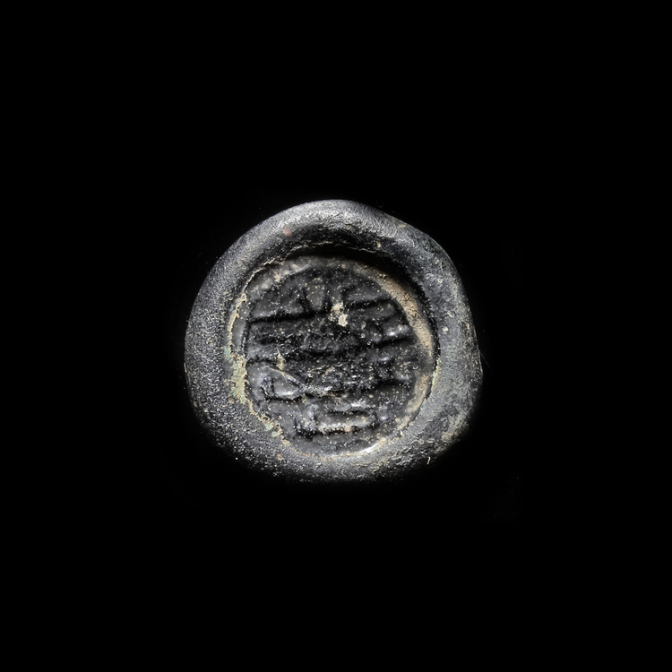 AN EARLY ISLAMIC GLASS WEIGHT OF DIRHAM, 10TH-11TH CENTURY
