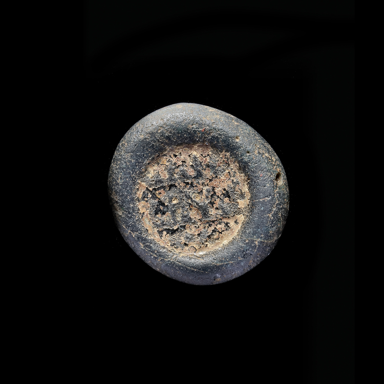AN EARLY ISLAMIC GLASS WEIGHT OF DOUBLE DIRHAM 10TH-11TH CENTURY