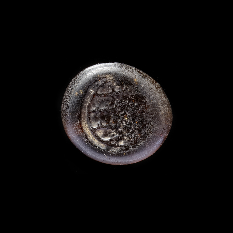 AN EARLY ISLAMIC GLASS WEIGHT OF DIRHAM, 10TH-11TH CENTURY