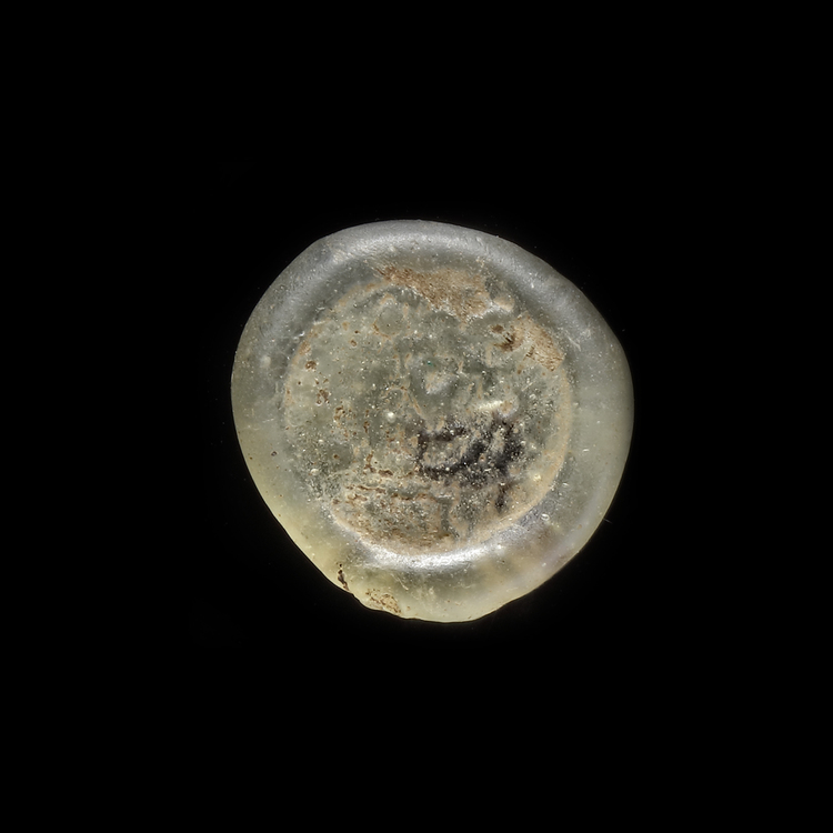 AN EARLY ISLAMIC GLASS WEIGHT OF DIRHAM, 10TH-11TH CENTURY