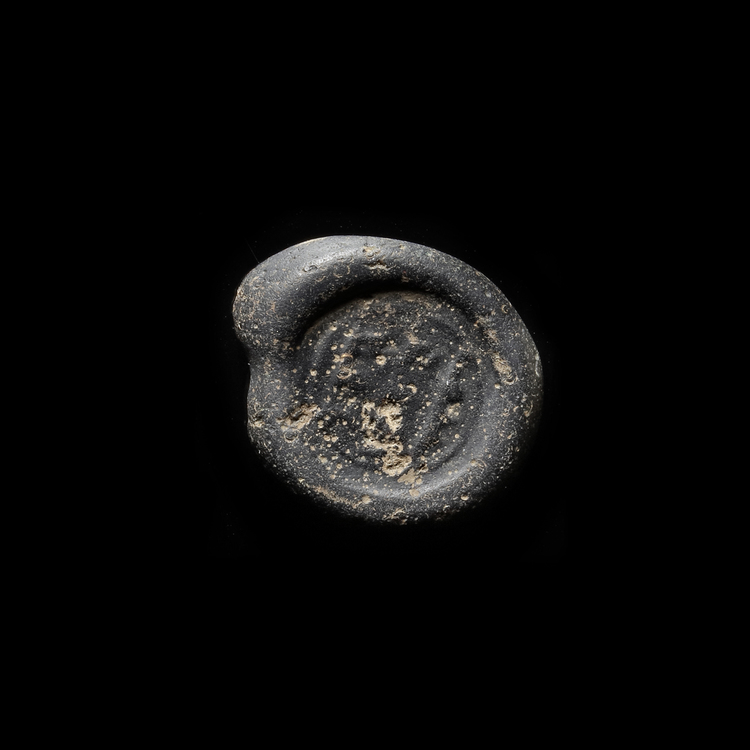 AN EARLY ISLAMIC GLASS WEIGHT OF DOUBLE DIRHAM, 10TH-11TH CENTURY