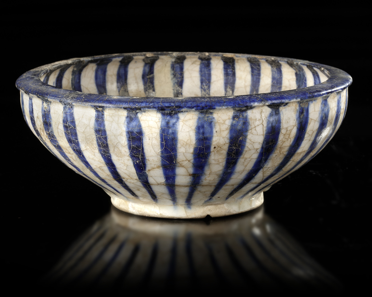 A KASHAN POTTERY BOWL, PERSIA, 13TH CENTURY
