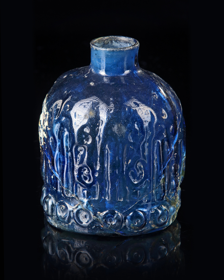 A BLUE GLASS BOTTLE, MESOPOTAMIAN REGION, 10TH CENTURY