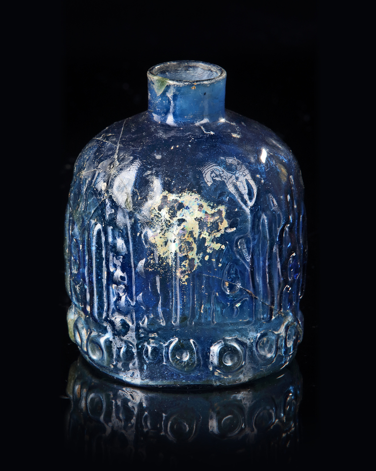 A BLUE GLASS BOTTLE, MESOPOTAMIAN REGION, 10TH CENTURY