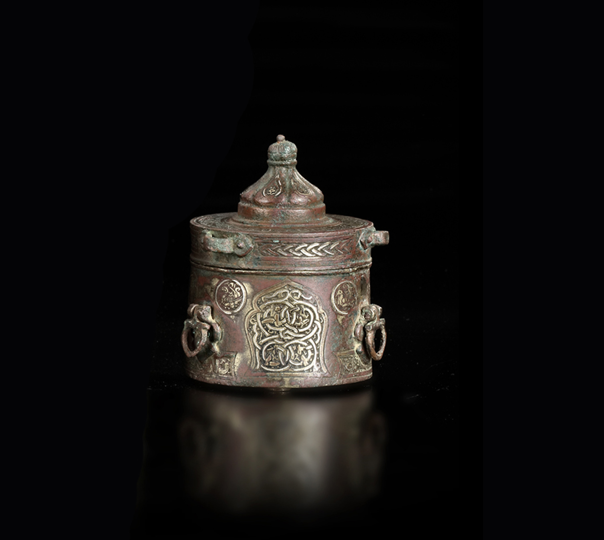 A KHURASAN SILVER- INLAID BRONZE INKWELL,12TH-13TH CENTURY