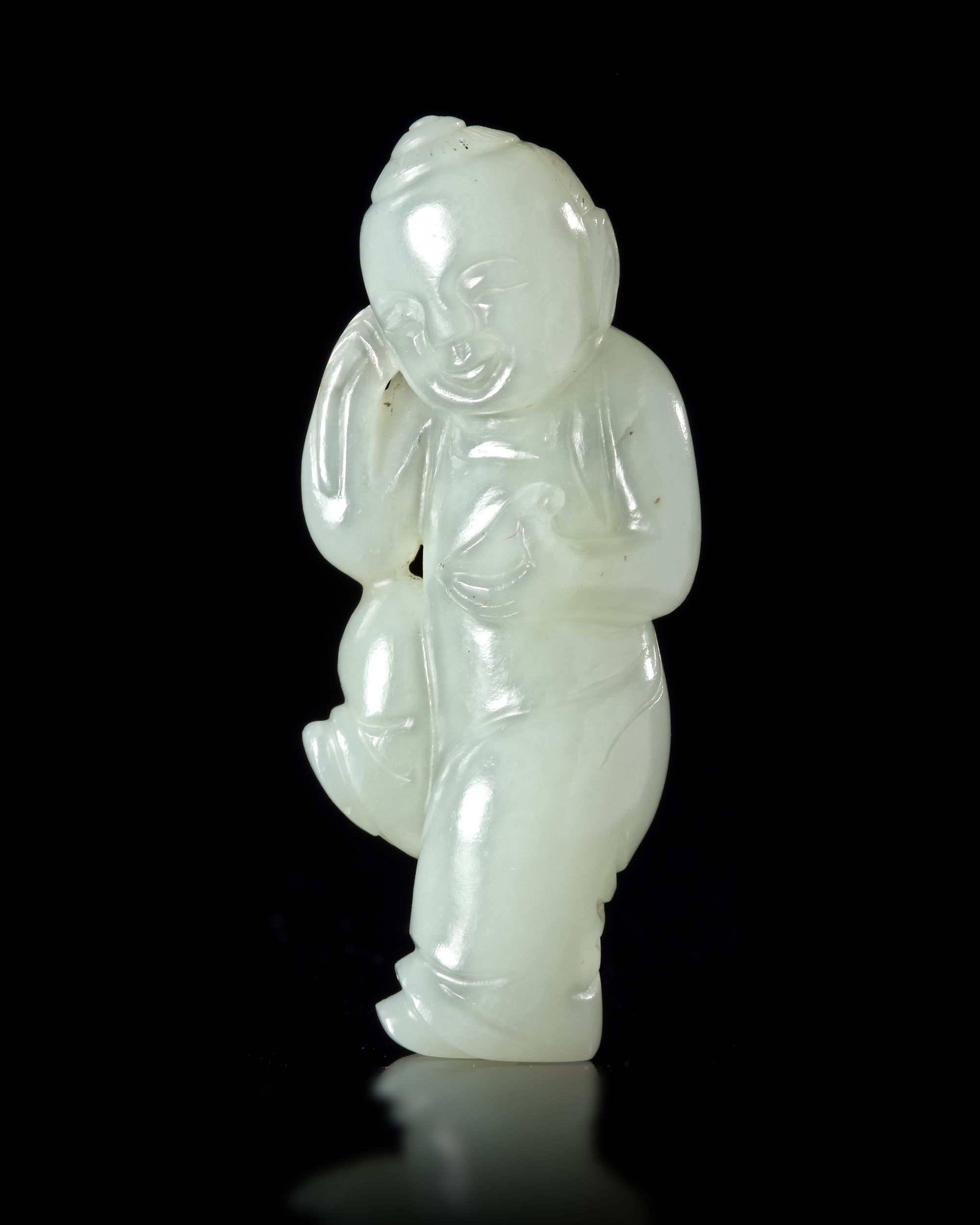 A CHINESE JADE CARVED FIGURE