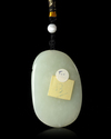 A CHINESE JADE CARVED PENDANT, 20TH CENTURY