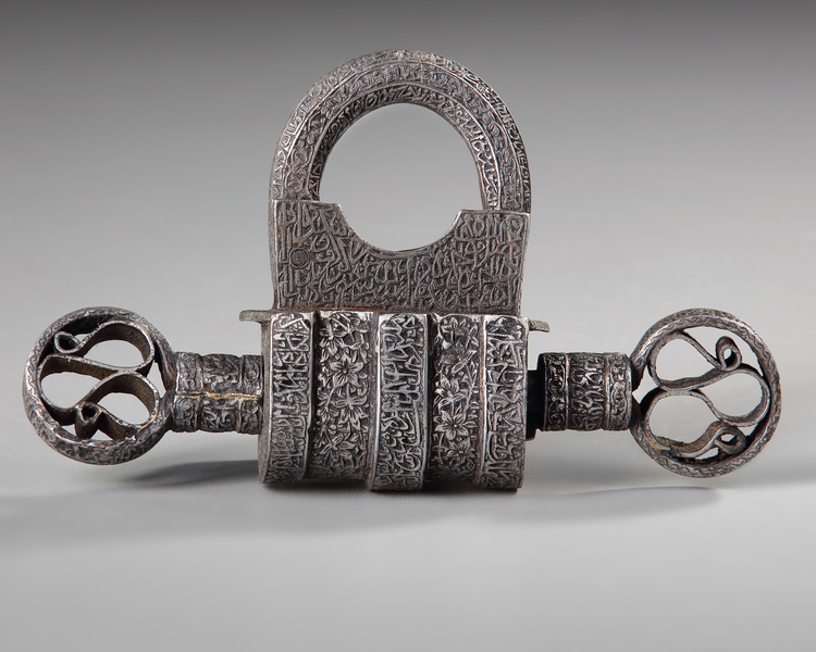 A SILVER INLAID METAL LOCK AND KEY,  20TH CENTURY