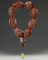 CHINESE CARVED HEDIAU FRUIT NUT BEADS, 19TH CENTURY