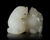 A CHINESE JADE CARVED BUDDHIST LION, 20TH CENTURY