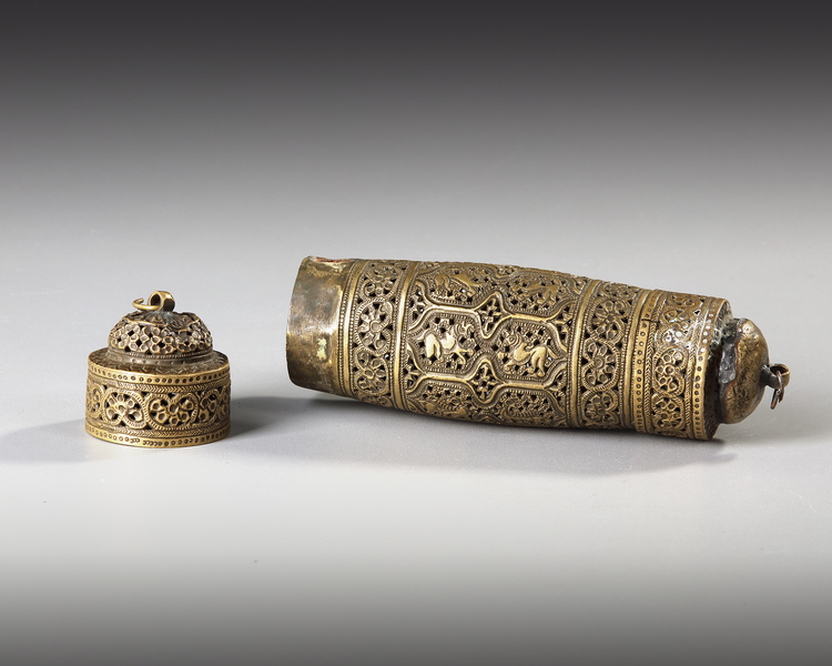 A GILT BRASS SCROLL HOLDER, INDIA 20TH CENTURY