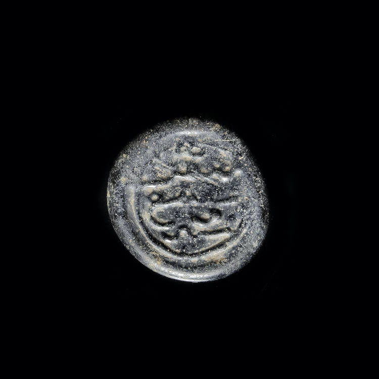 AN EARLY ISLAMIC GLASS WEIGHT OF DIRHAM, 13TH-14TH CENTURY