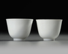 A  PAIR OF SMALL CHINESE WHITE-GLAZED PHOENIX CUPS, 20TH CENTURY
