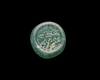 AN EARLY ISLAMIC GLASS WEIGHT OF HALF DIRHAM