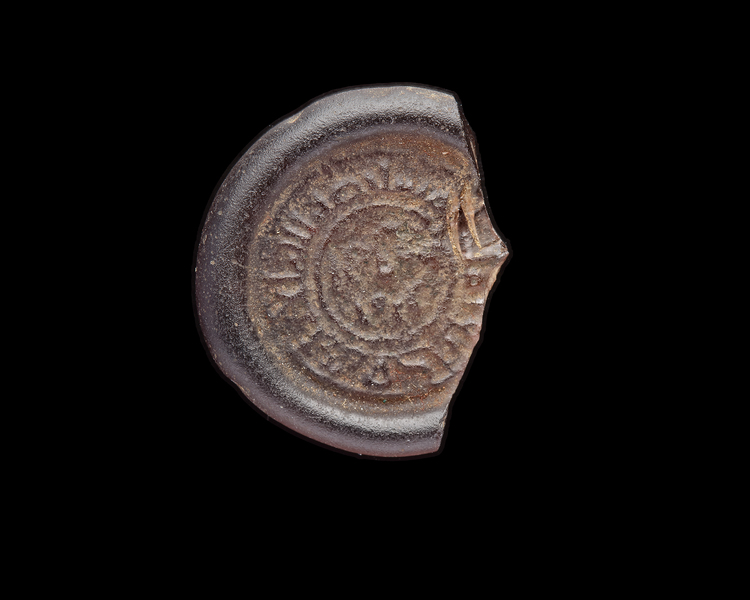 AN EARLY ISLAMIC GLASS WEIGHT OF DIRHAM