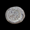AN EARLY ISLAMIC GLASS WEIGHT OF HALF DINAR