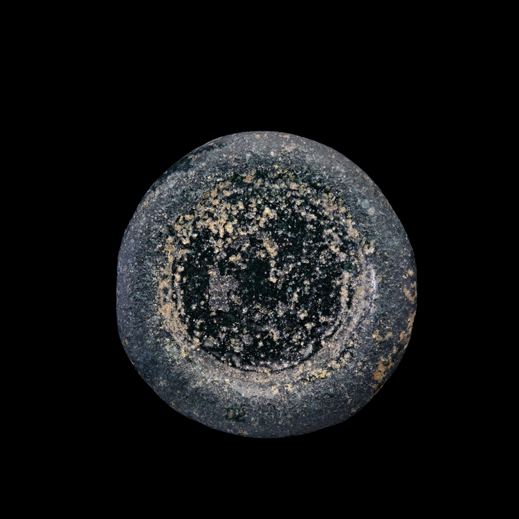 AN EARLY ISLAMIC GLASS WEIGHT OF DOUBLE DINAR