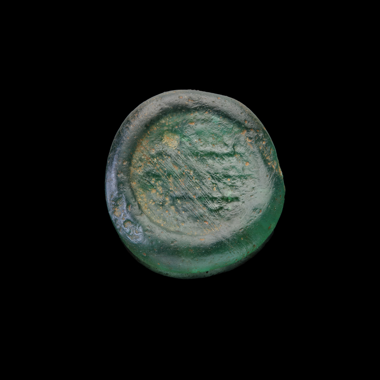 AN EARLY ISLAMIC GLASS WEIGHT OF DOUBLE DIRHAM