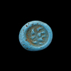 AN EARLY ISLAMIC GLASS WEIGHT OF QUARTER DINAR