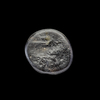 AN EARLY ISLAMIC GLASS WEIGHT OF QUARTER DIRHAM