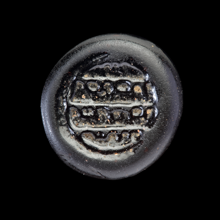 AN EARLY ISLAMIC GLASS WEIGHT OF DIRHAM, 10TH-11TH CENTURY