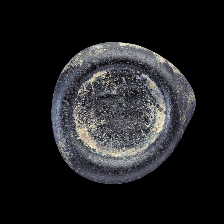 AN EARLY ISLAMIC GLASS WEIGHT OF DIRHAM