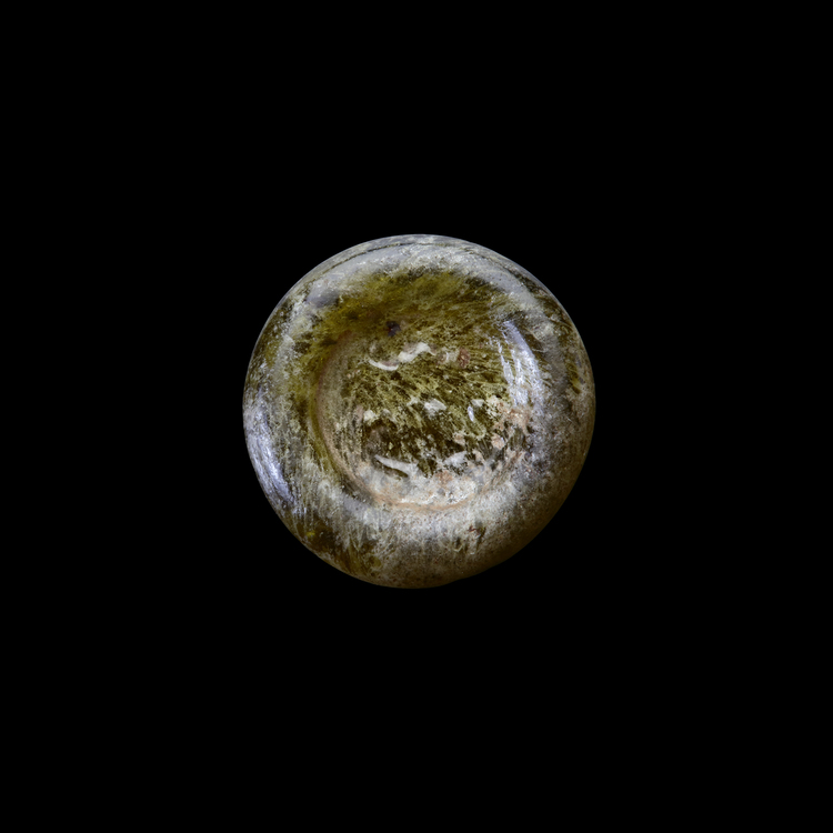 AN EARLY ISLAMIC GLASS WEIGHT OF HALF DIRHAM, 10TH-11TH CENTURY