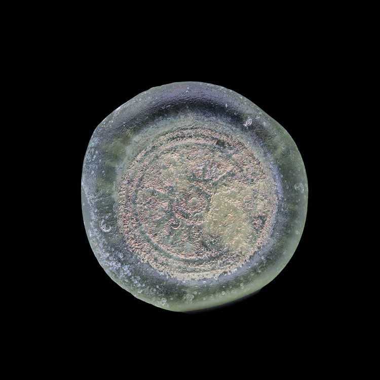 AN EARLY ISLAMIC GLASS WEIGHT OF DOUBLE DIRHAM