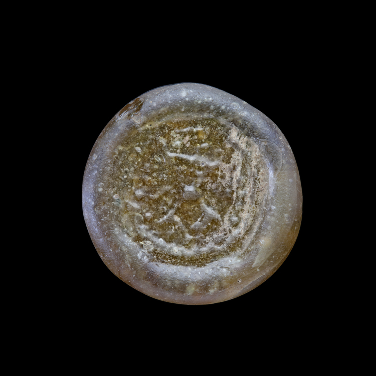 AN EARLY ISLAMIC GLASS WEIGHT OF DIRHAM, 10TH-11TH CENTURY