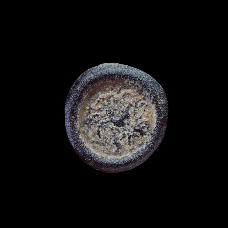AN EARLY ISLAMIC GLASS WEIGHT OF DIRHAM, 10TH-11TH CENTURY