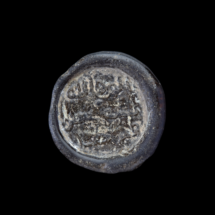 AN EARLY ISLAMIC GLASS WEIGHT OF DIRHAM, 10TH-11TH CENTURY