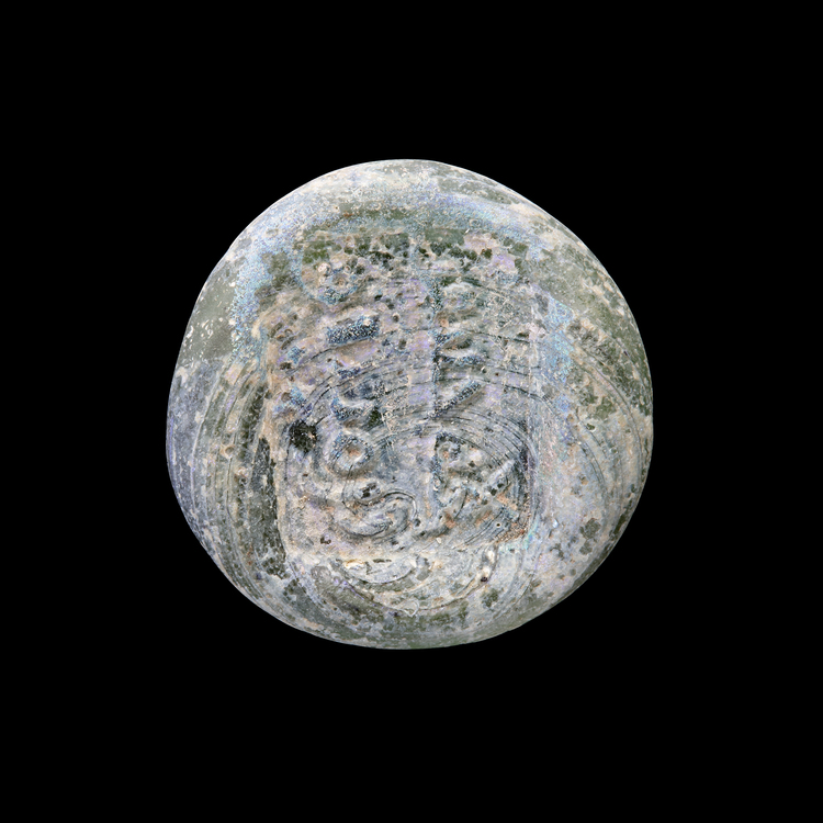 AN EARLY ISLAMIC GLASS WEIGHT OF DINAR, 10TH-11TH CENTURY